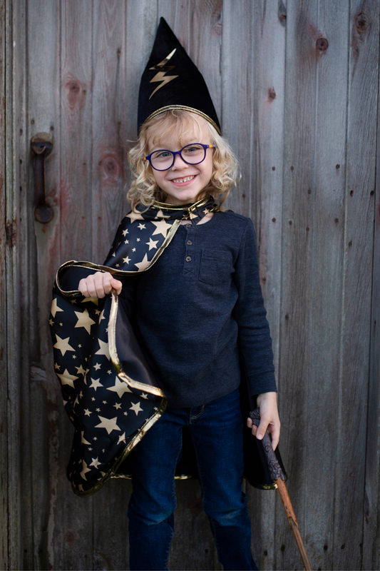 Great Pretenders Reversible Wizard Cape & Hat – Size 4–6. Wand, clothing, glasses and footwear shown are not included.